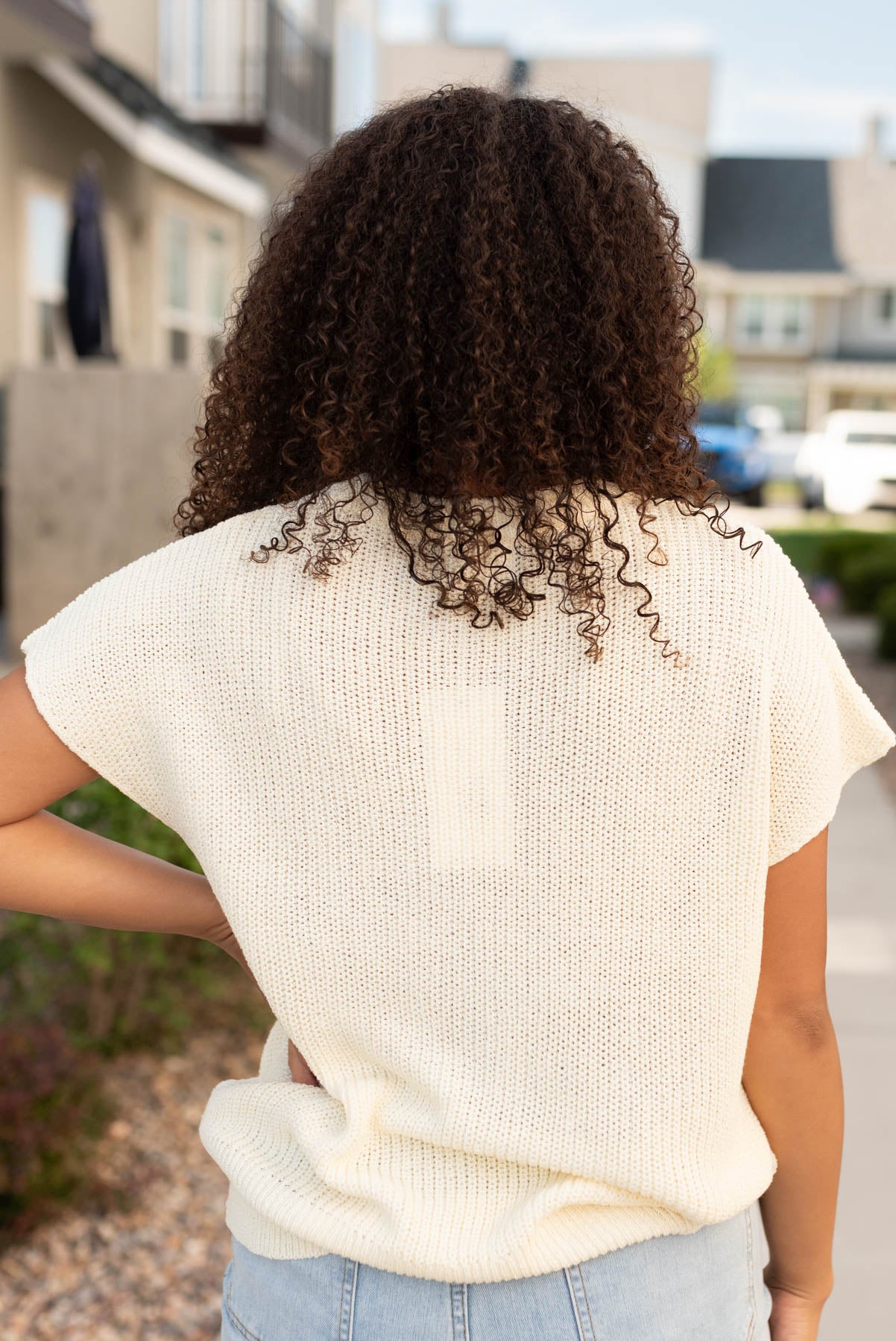 Back view of the cream floral sweater