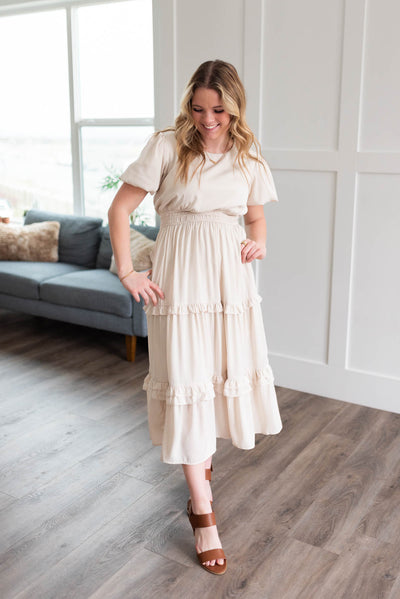 Ivory satin ruffle dress with short sleeves