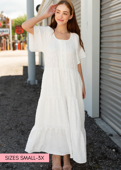 White woven pattern dress with buttons on the bodice