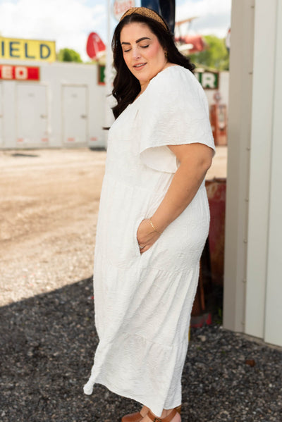 Side view of the white woven pattern dress