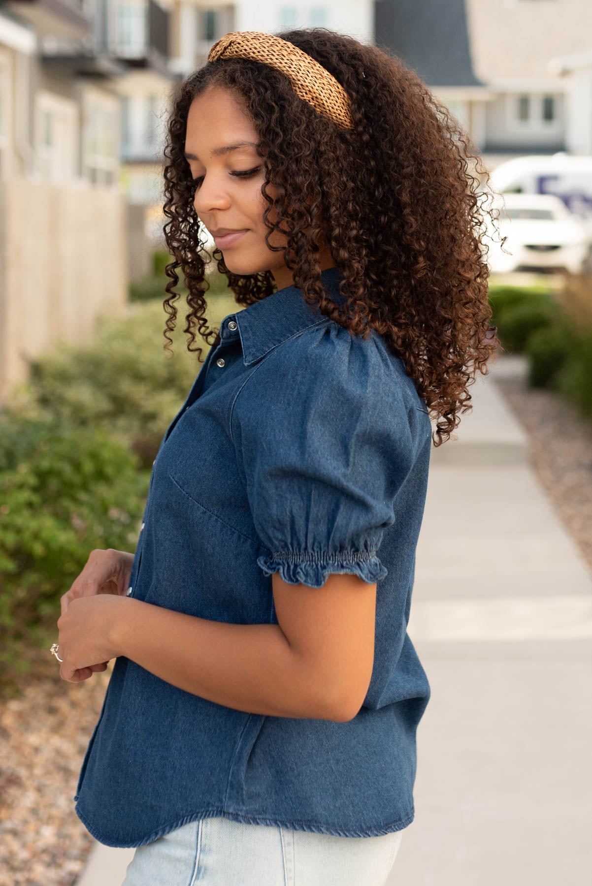 Side view of the denim puff sleeve top