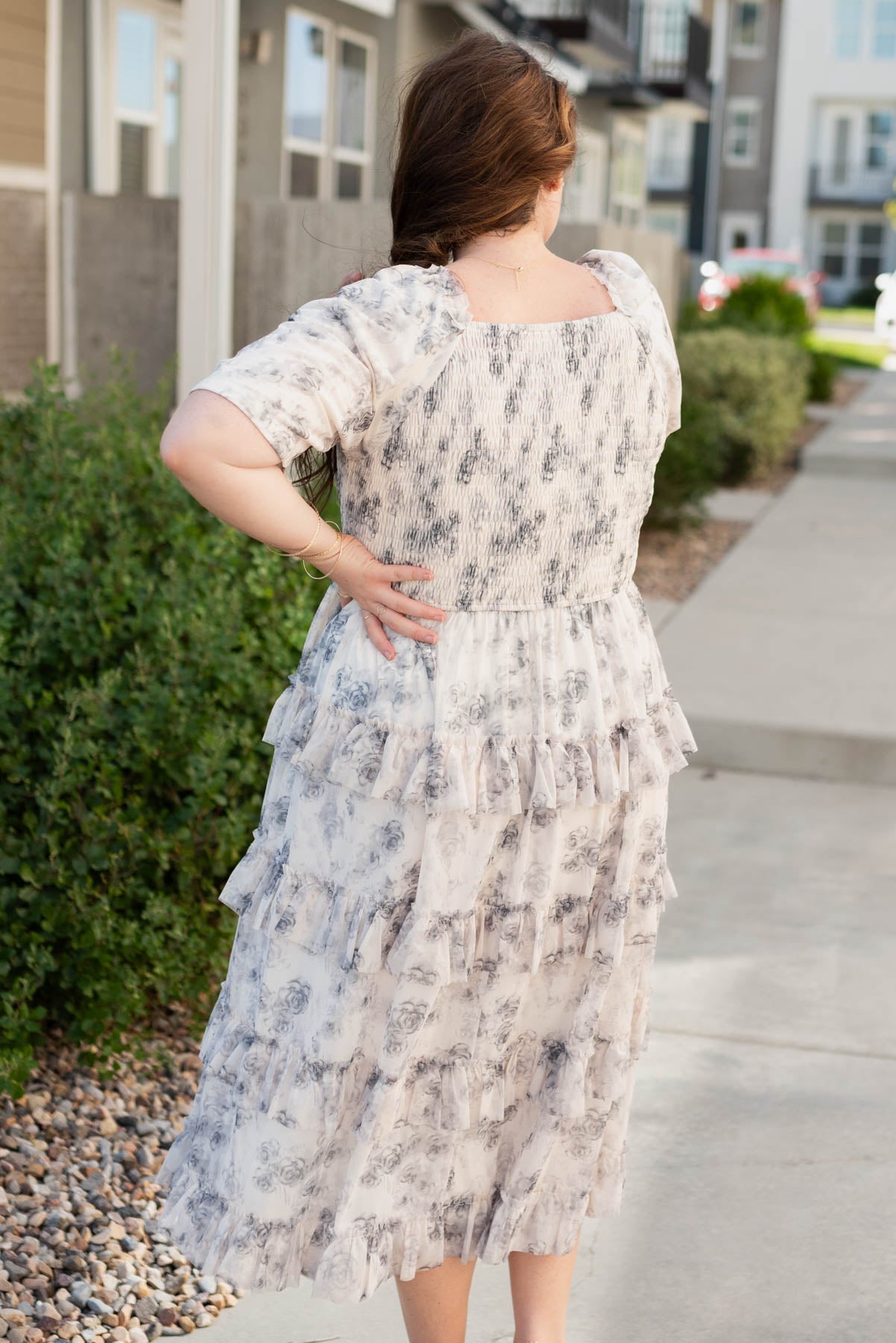 Back view of the plus size grey floral tiered dress