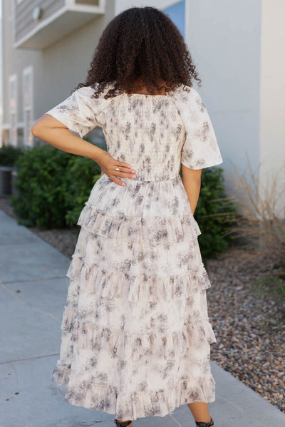 Back view of the grey floral tiered dress