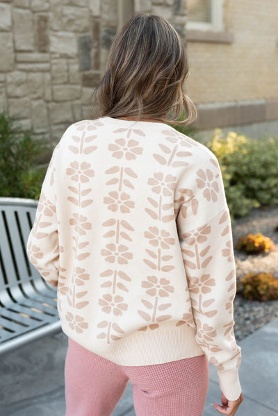 Back view of the oatmeal floral sweater