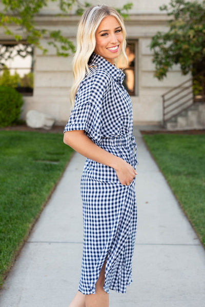 Side view of the navy plaid dress with a collar