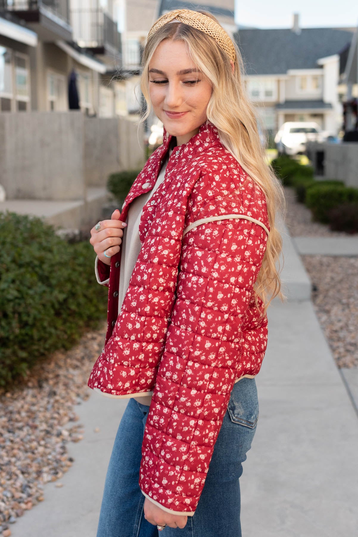 Side view of the red floral quilted jacket 