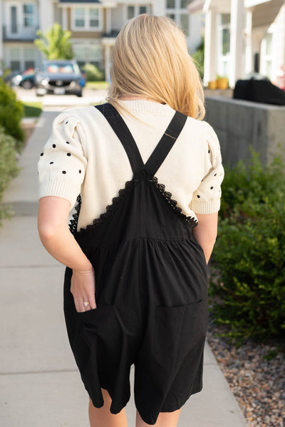 Back view of the black lace shortalls with back pockets