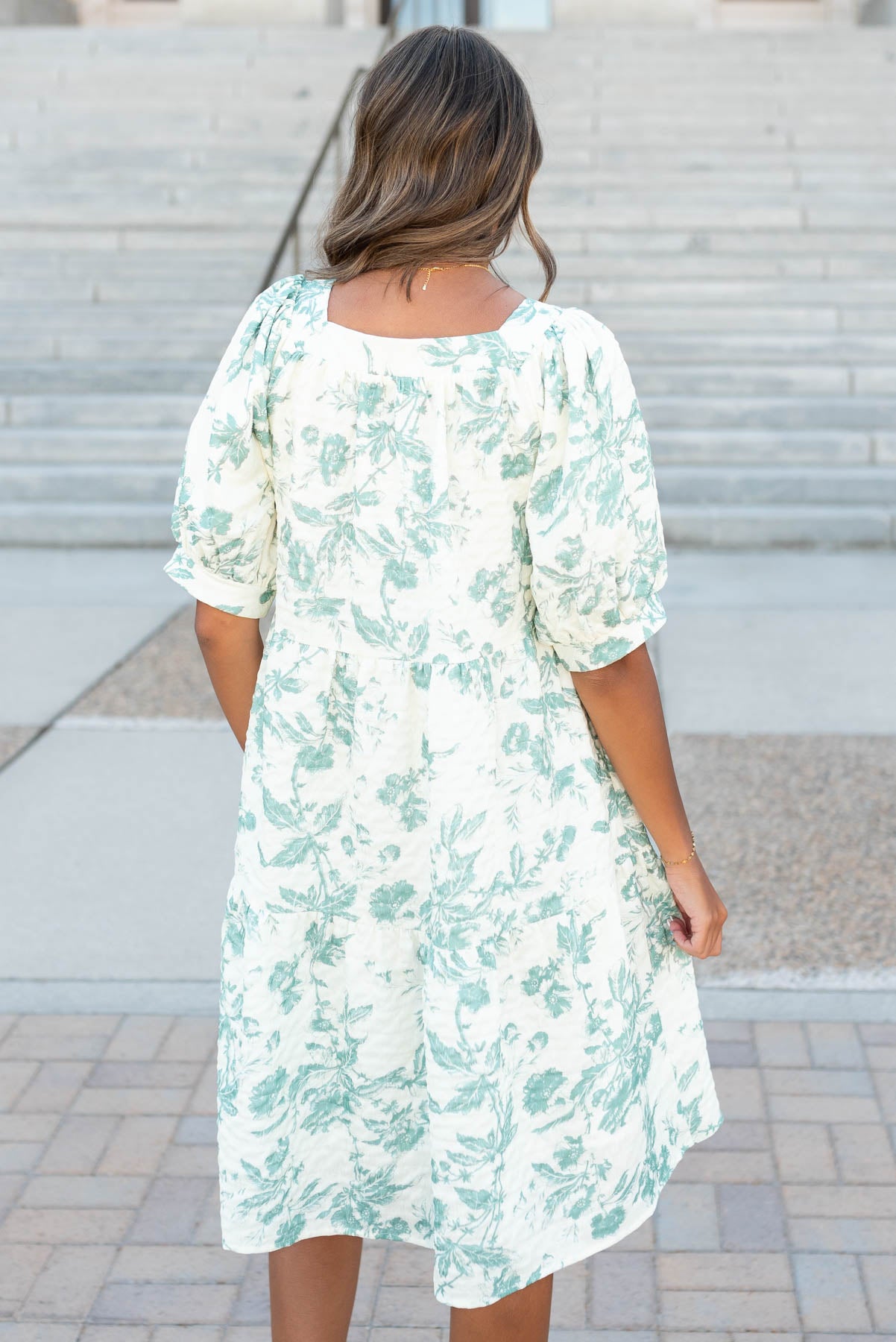 Back view of the green floral tiered dress