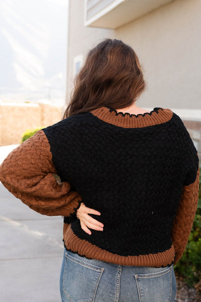 Back view of the black knit cardigan in plus size