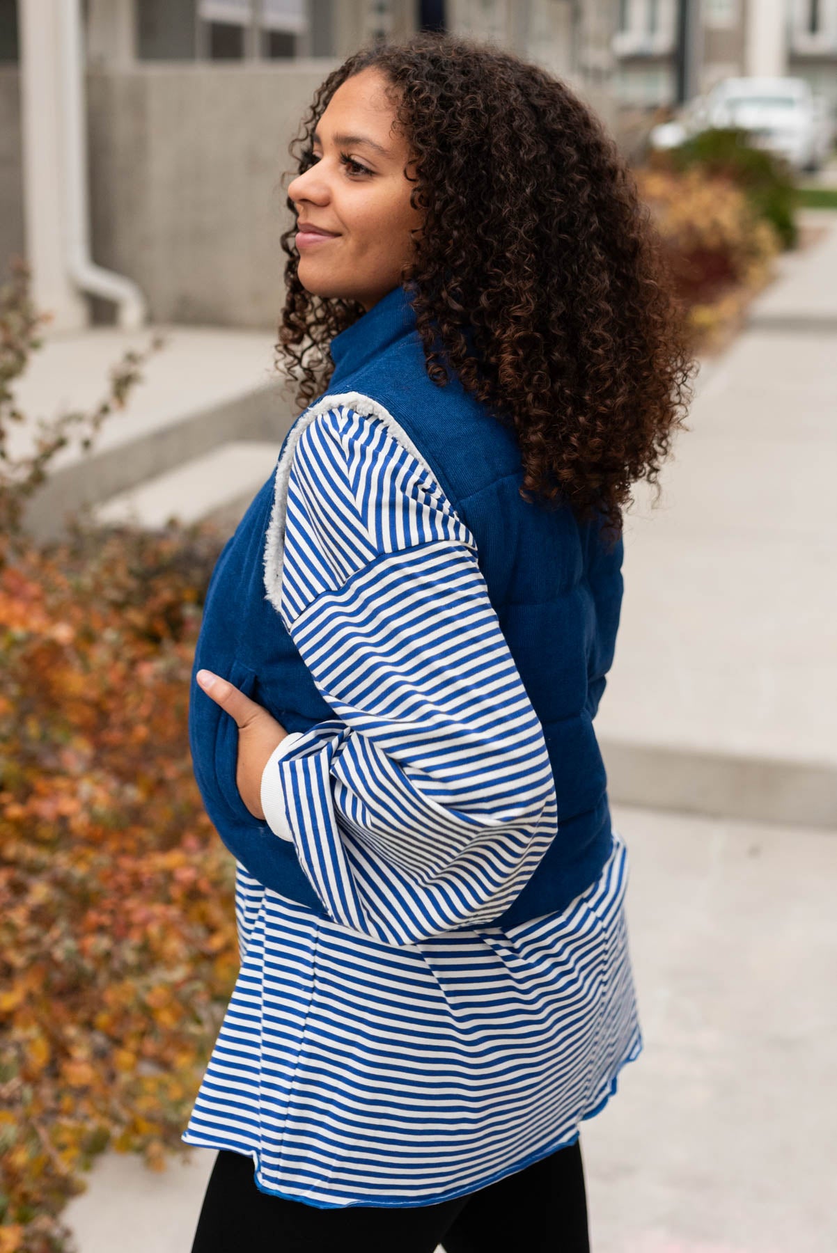 Side view of the blue corduroy vest