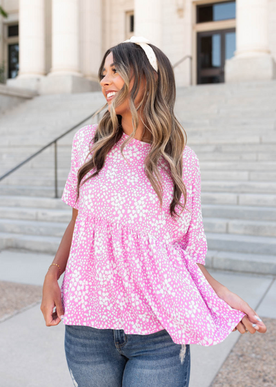 Pink floral peplum top with short sleeves