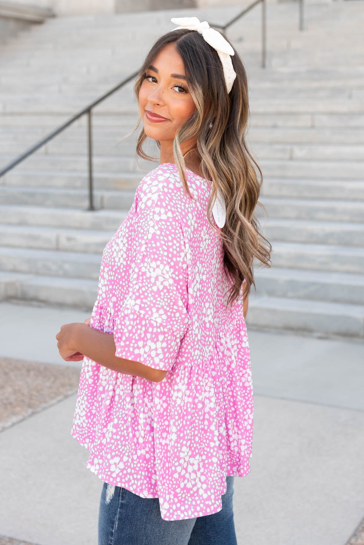 Side view of the pink floral peplum top