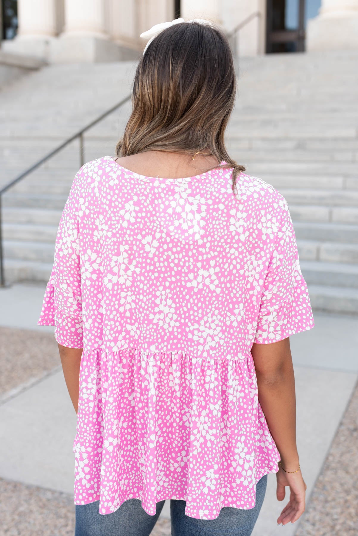 Back view of the pink floral peplum top