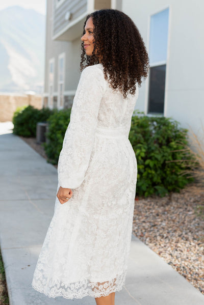 Side view of the white floral embroidered dress