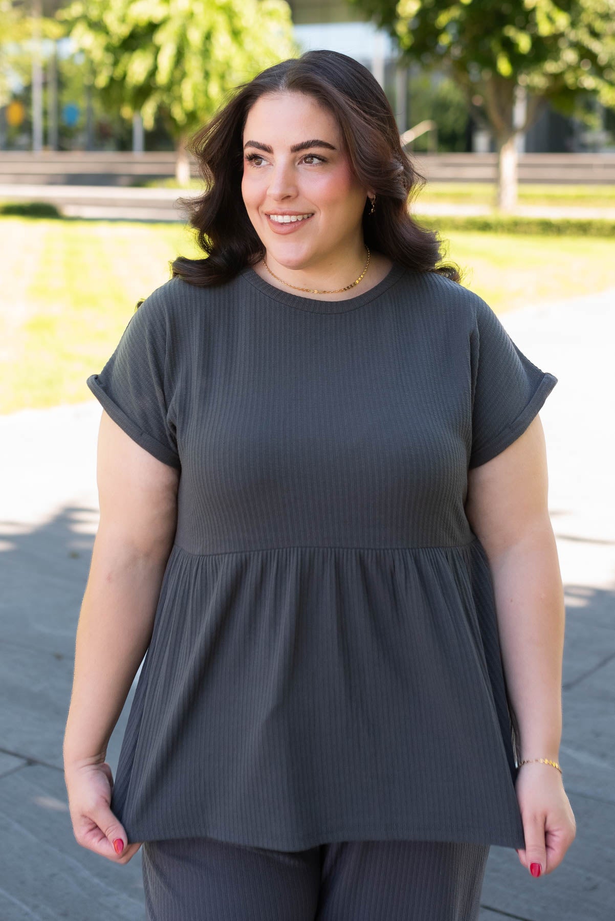 Front view of the plus size charcoal rib knit top