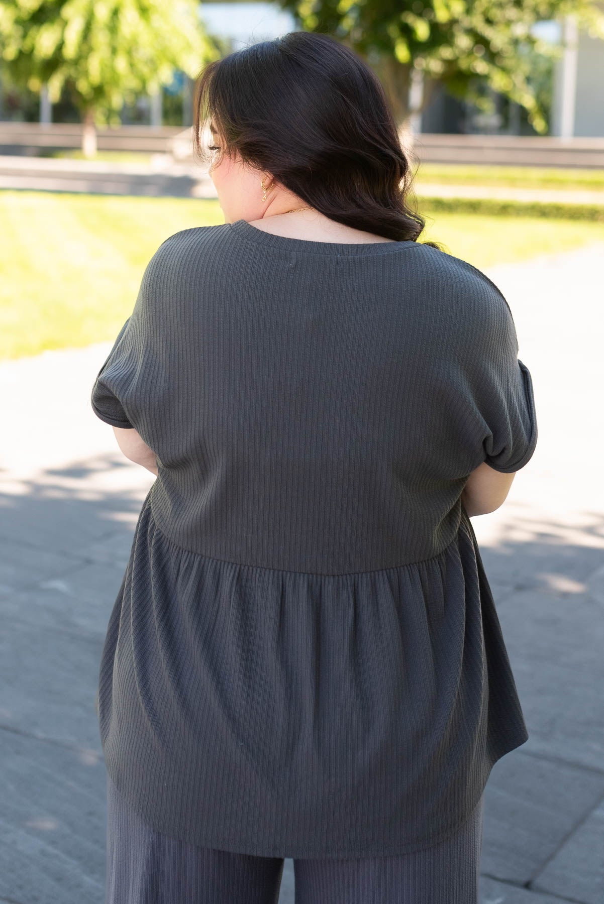 Back view of the plus size charcoal rib knit top