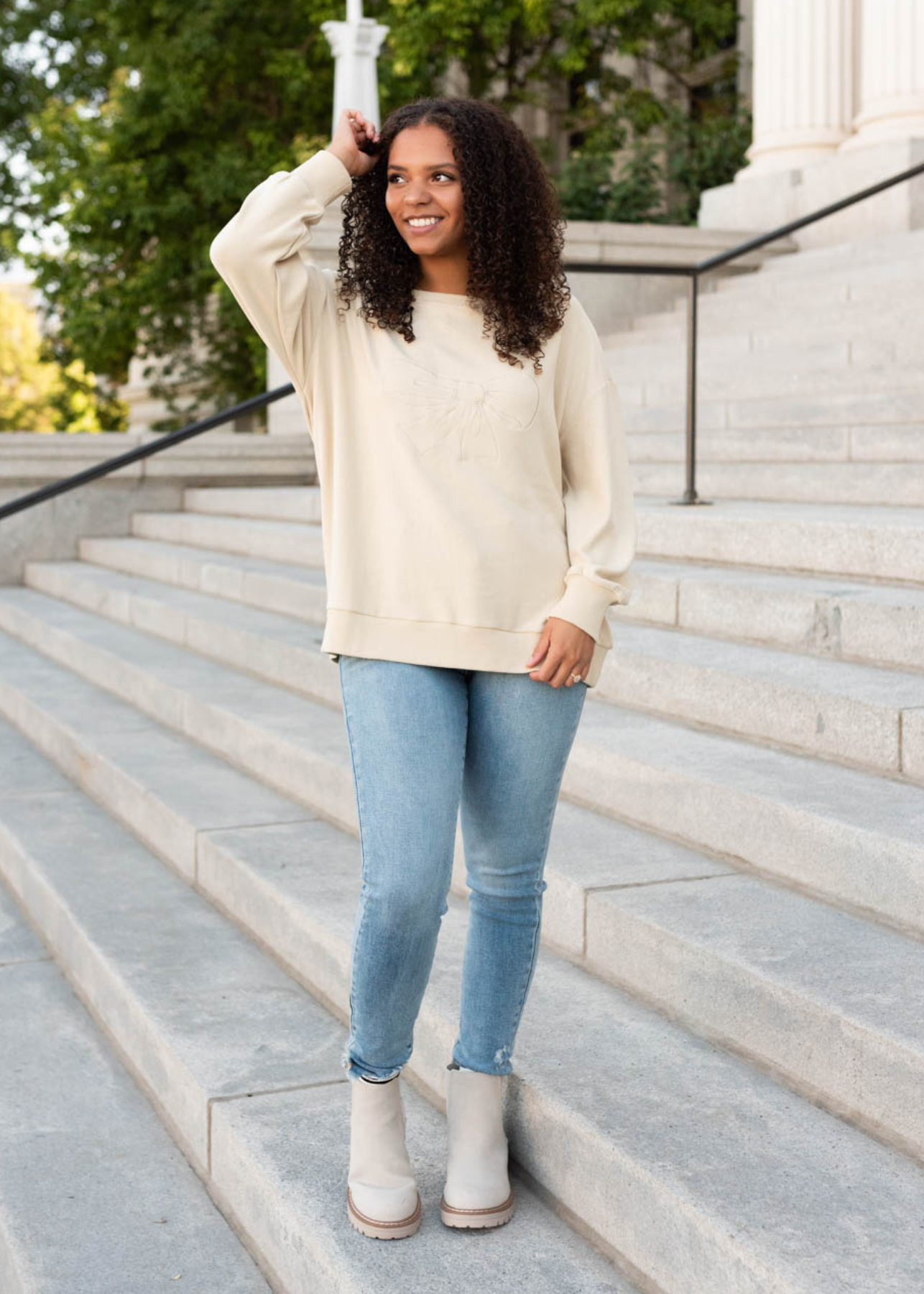 Beige embroidered bow pullover with long sleeves