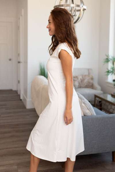 Side view of a white slipette midi cap sleeve