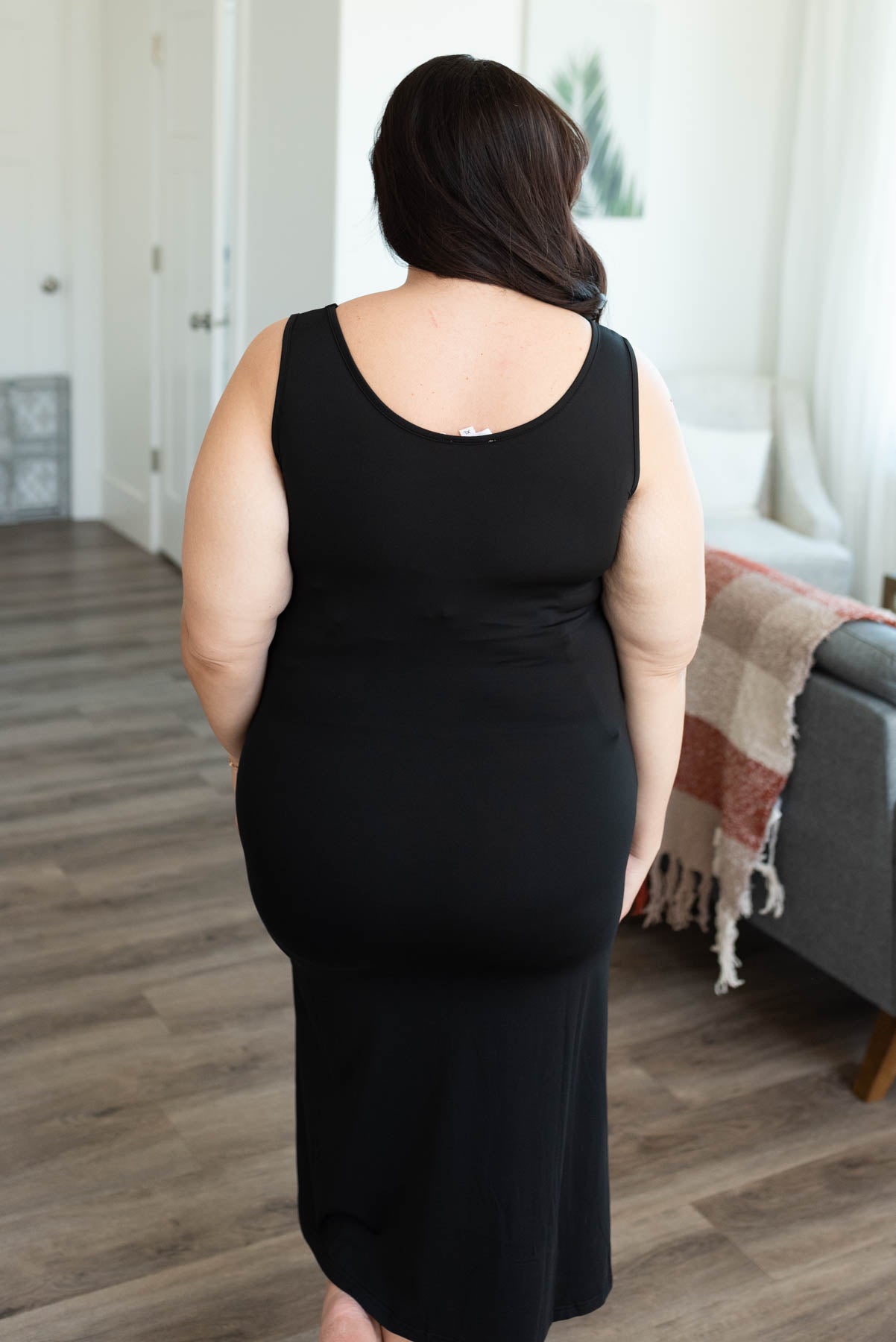 Back view of the black plus size midi tank