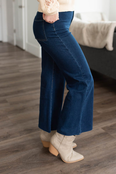 Side view of the dark denim wide leg pants