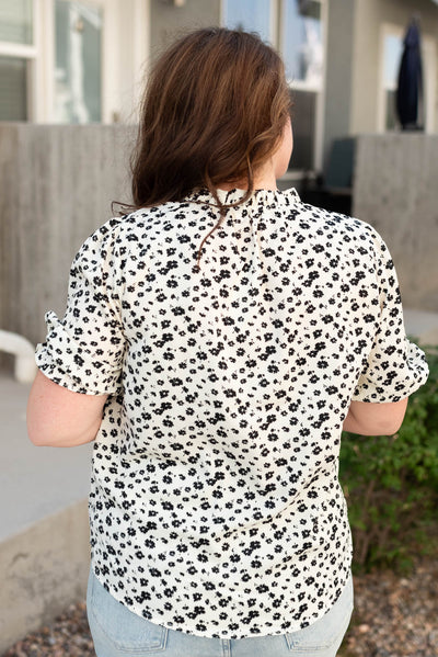 Back view of the plus size black floral top