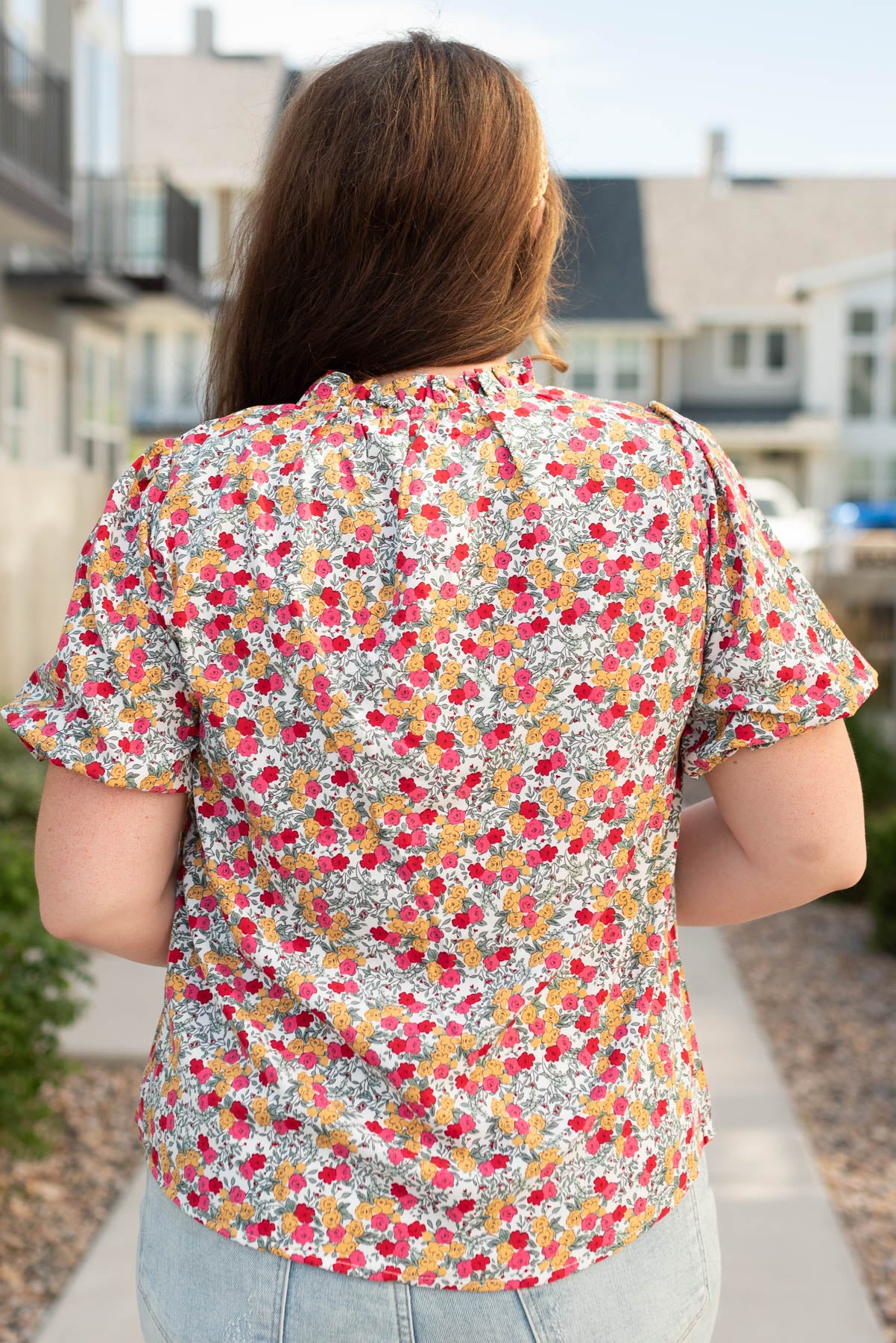 Back view of the plus size white multi floral top