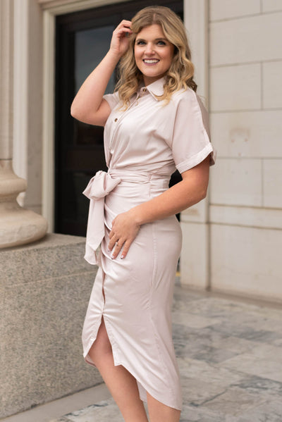 Side view of a champagne satin dress