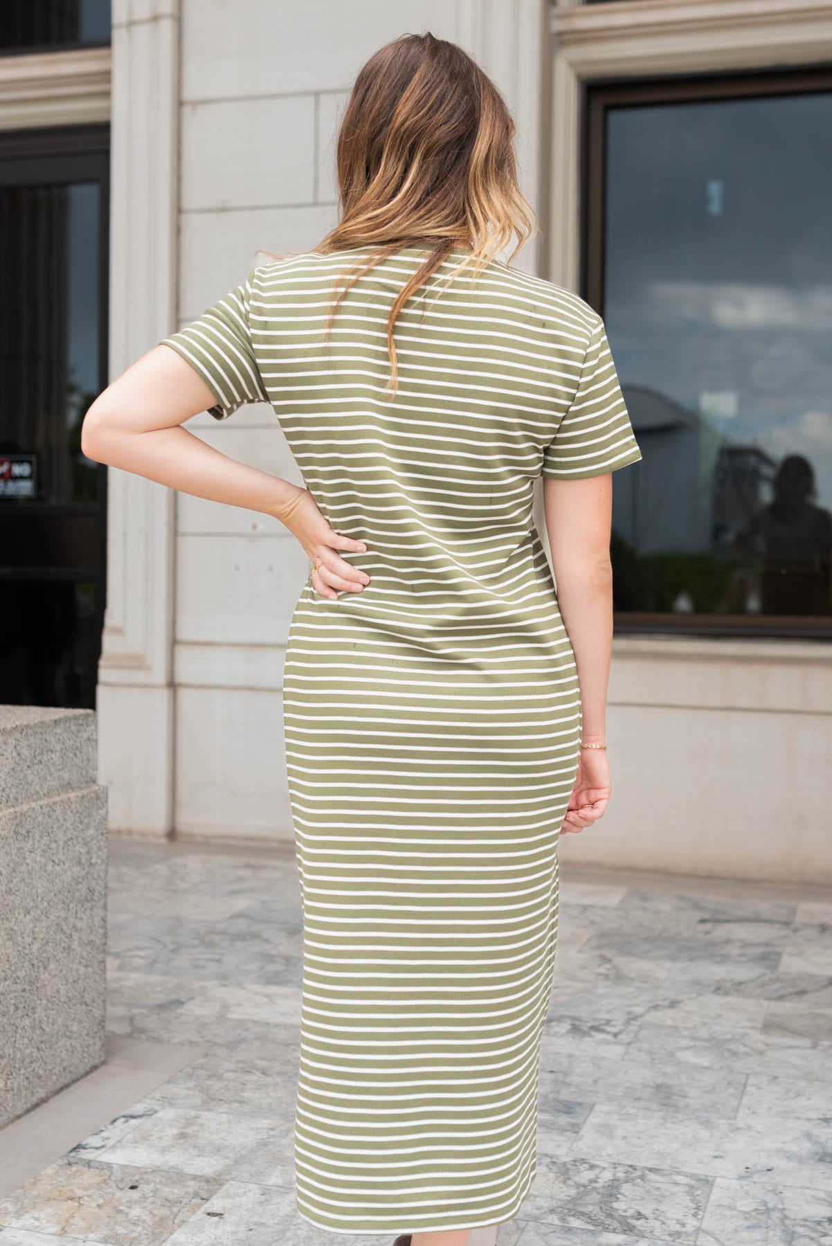 Back view of the olive stipe t-shirt dress