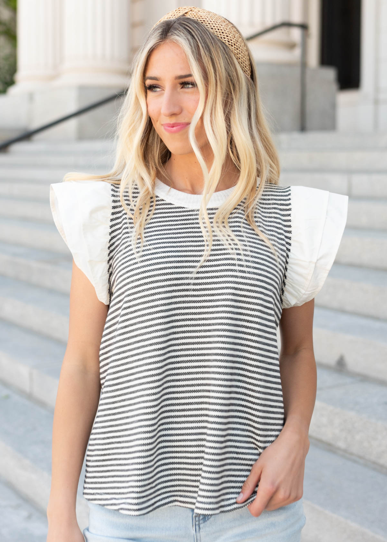 Front view of the black stripe knit top