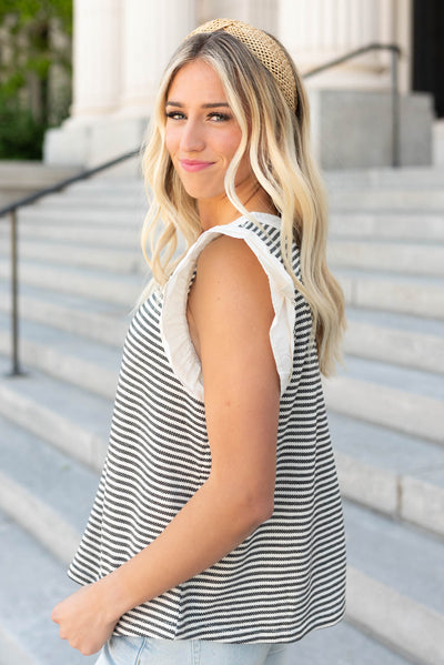 Side view of the black stripe knit top