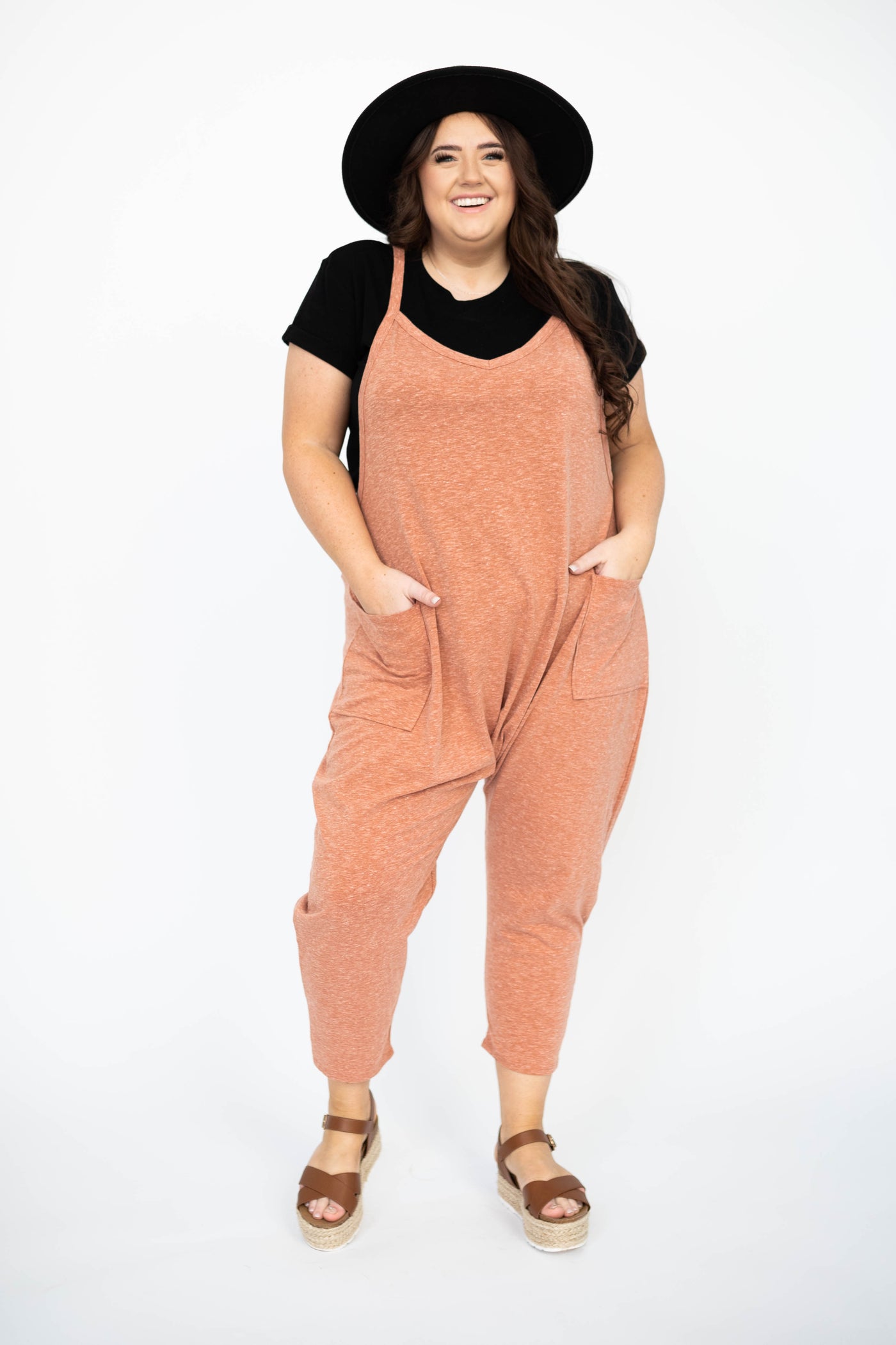 Knit plus size rust jumpsuit with pockets