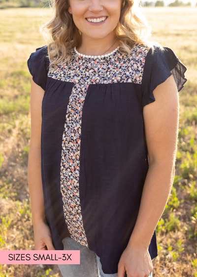 Navy top with cap sleeves