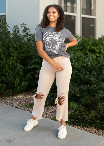 Dusty mauve jeans with distressed knees and hem