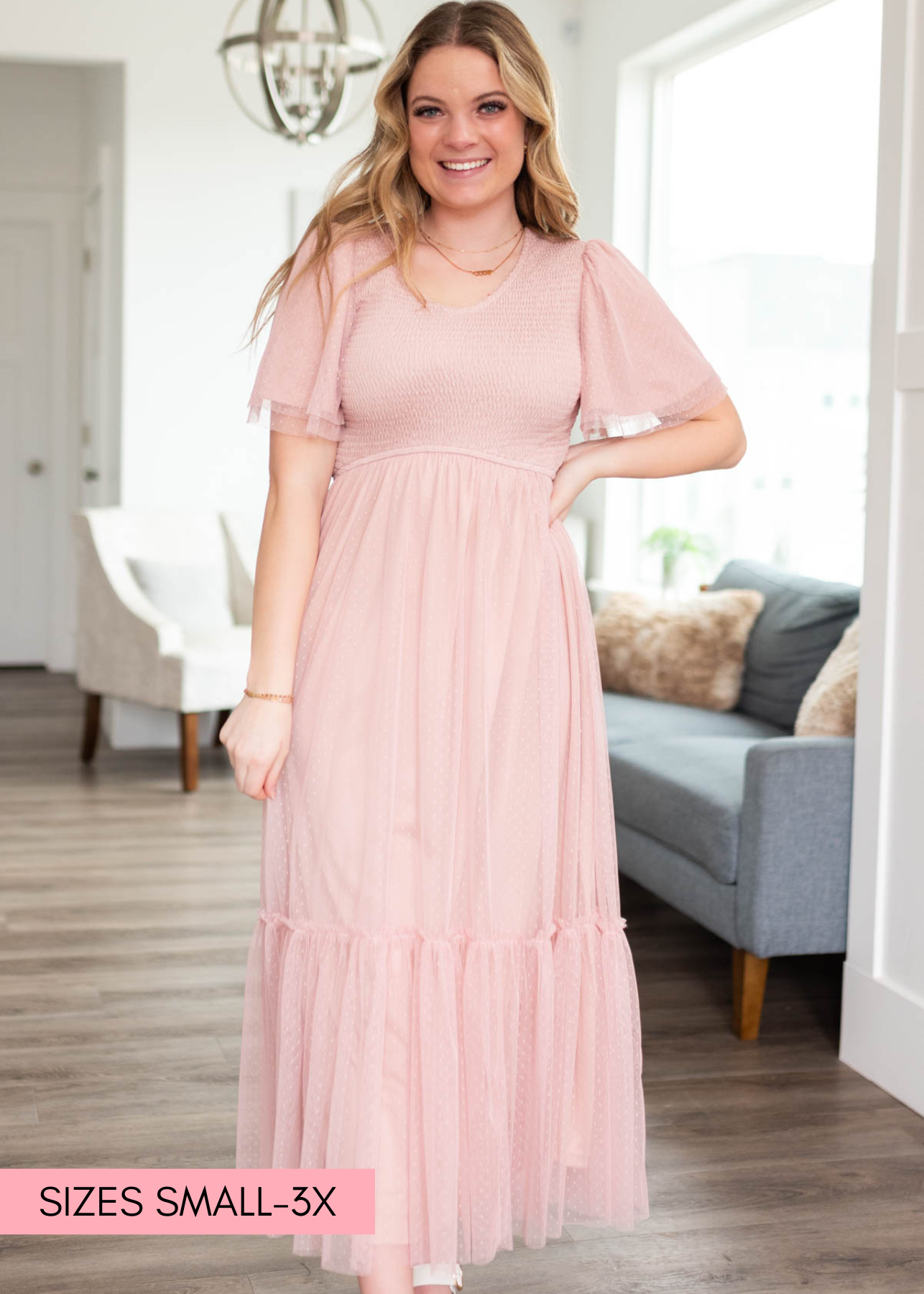 Blush smocked mesh dress with ruffle on the hem of the skirt