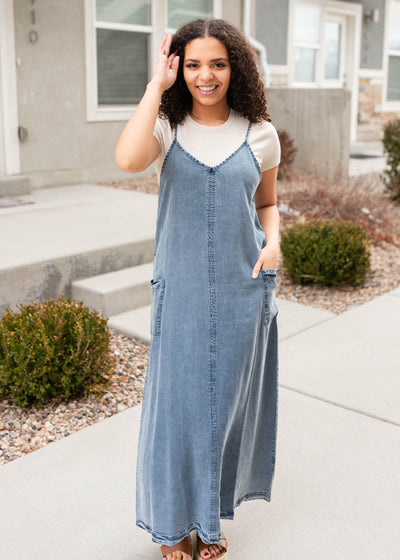 Front view of the denim blue overall dress