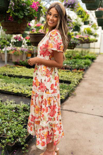 Side view of the red multi floral tiered dress