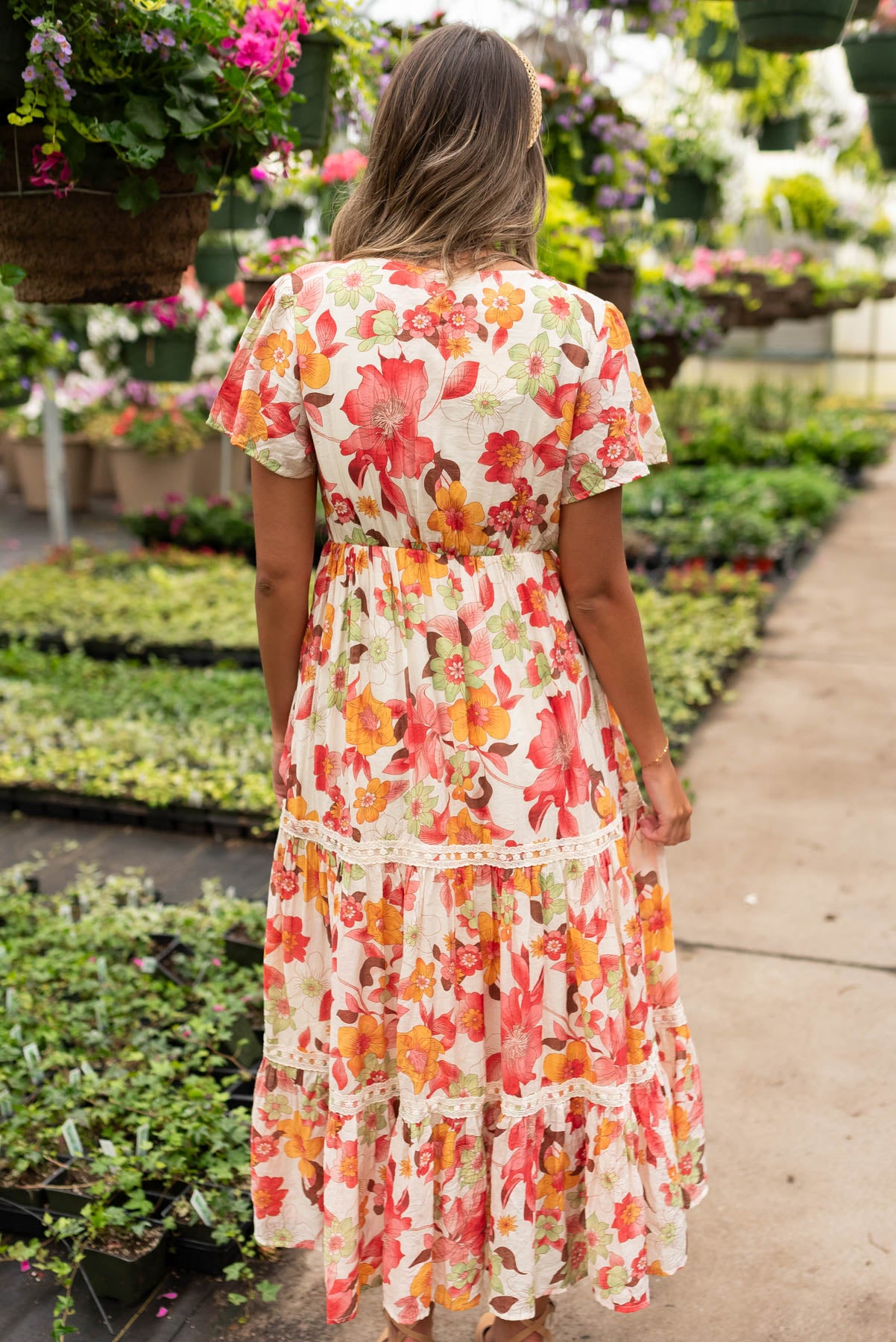 Back view of the red multi floral tiered dress