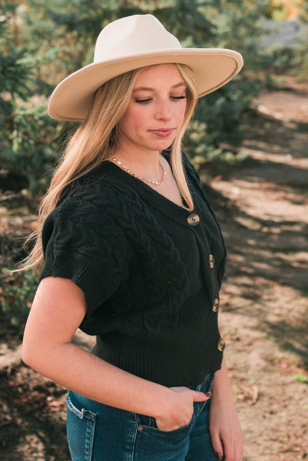 Side view of the black knit cardigan