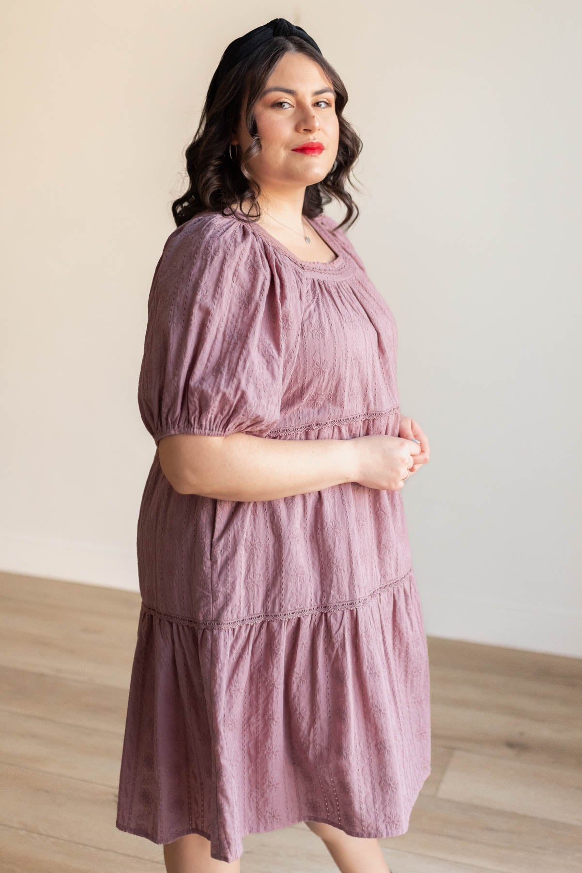 Side view of the dusty mauve embroidered dress in plus size