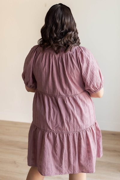 Back view of the  dusty mauve embroidered dress