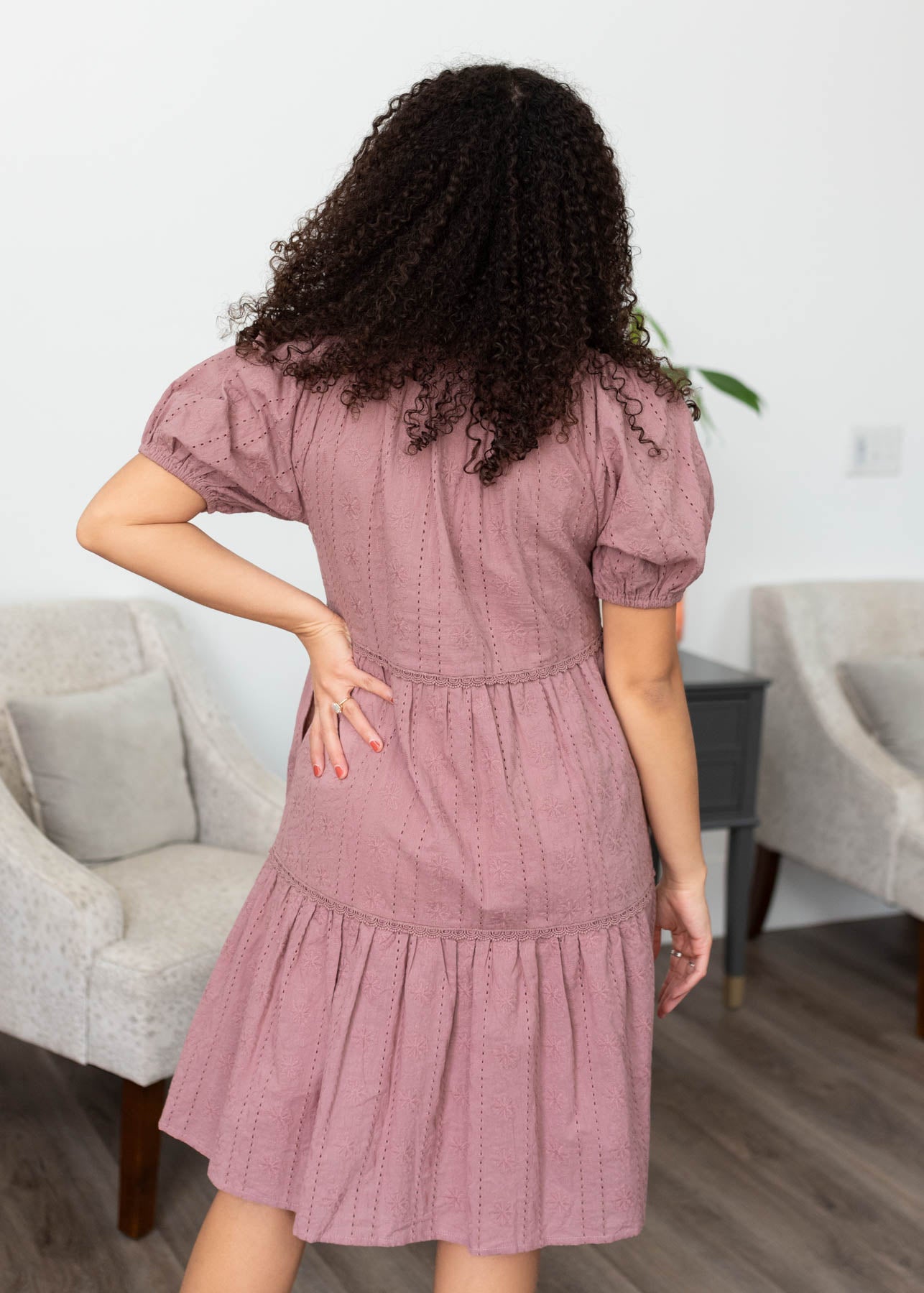 Back view of the dusty mauve embroidered dress