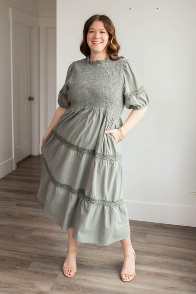 Plus size dark sage tiered dress with lace on the skirt and pockets