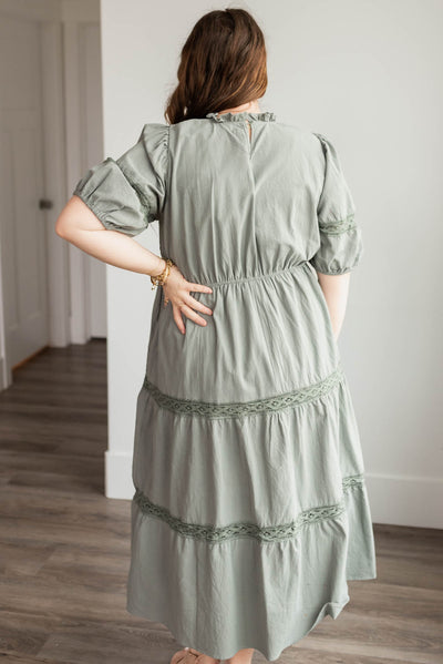 Back view of the plus size dark sage tiered dress