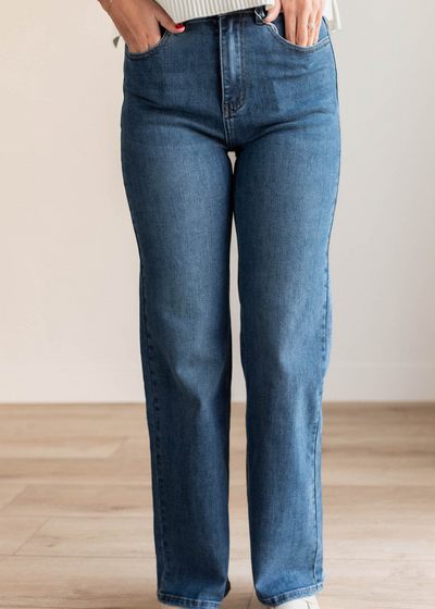 Close up of the medium wash high rise straight jeans