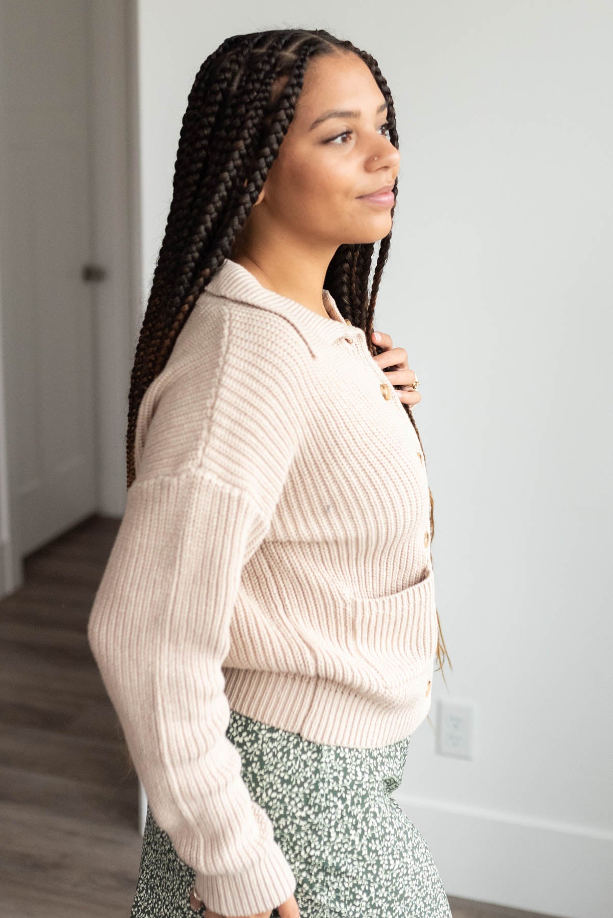 Side view of the taupe collared button down cardigan