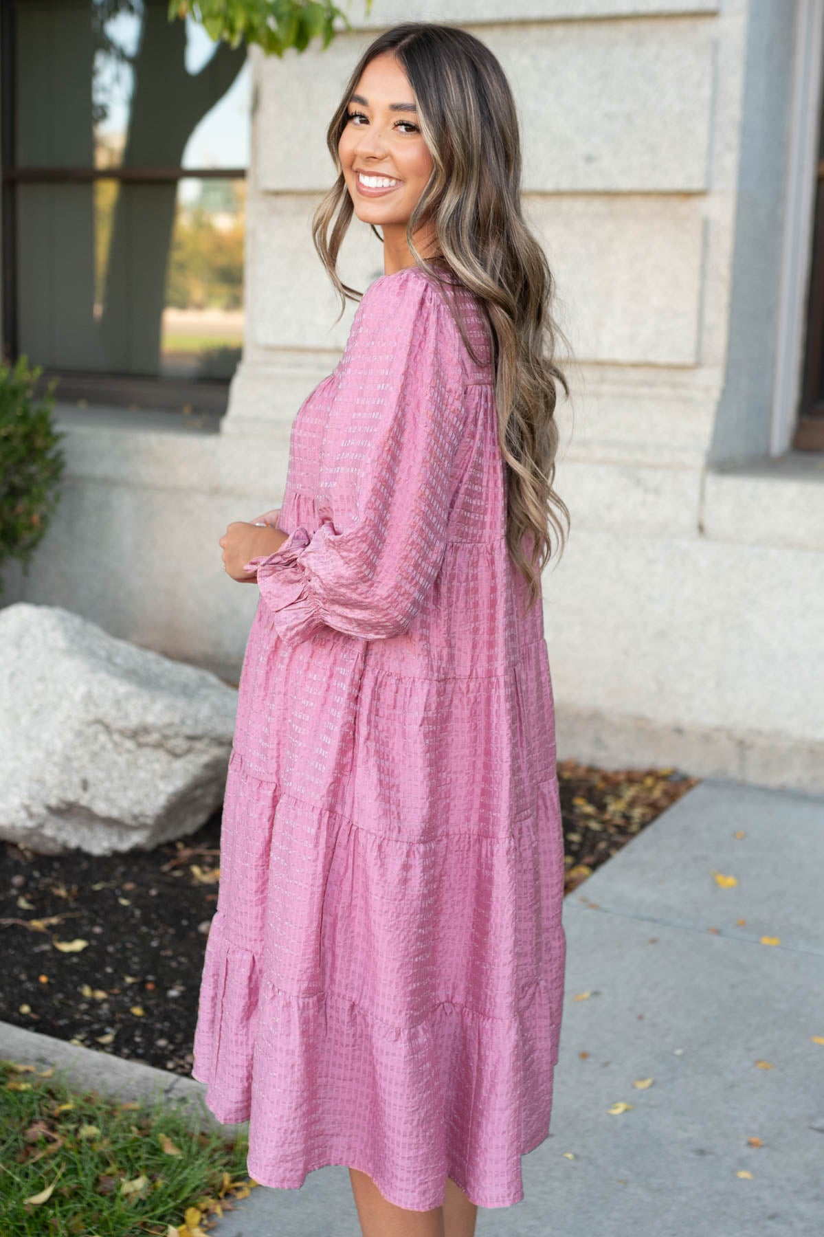 Side view of the pink long sleeve dress