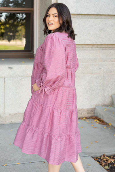 Side view of the plus size pink long sleeve dress