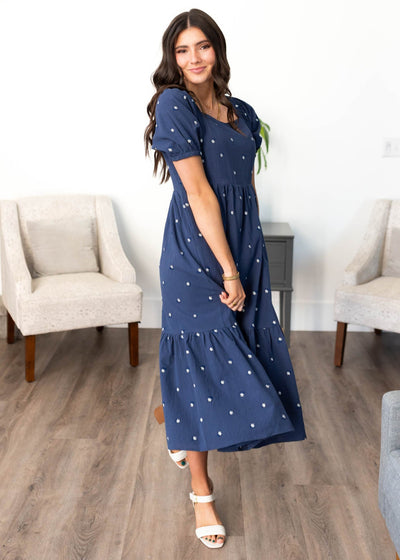 Navy embroidered flroal dress with wide ruffle hem