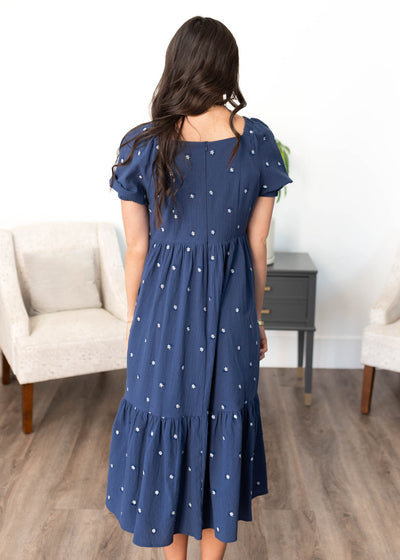 Back view of the navy embroidered floral dress