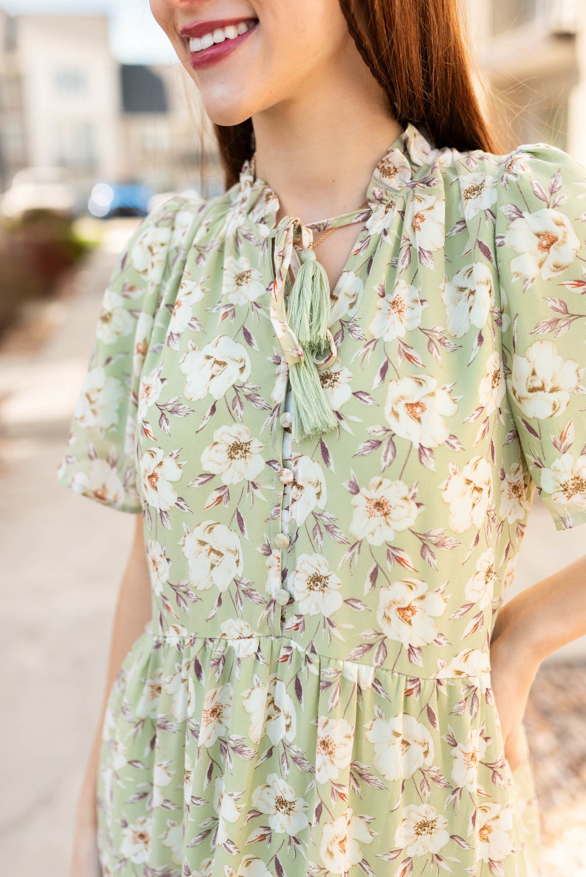 Close up of the fabric on the sage floral dress